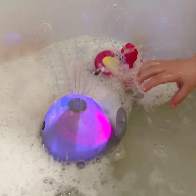 Jouet de bain électrique en forme de baleine – Jet d'eau et lumières LED !