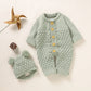Ensemble combinaison et bonnet tricotés pour bébé