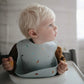 Bavoir bébé ajustable en silicone imperméable avec poche à miettes